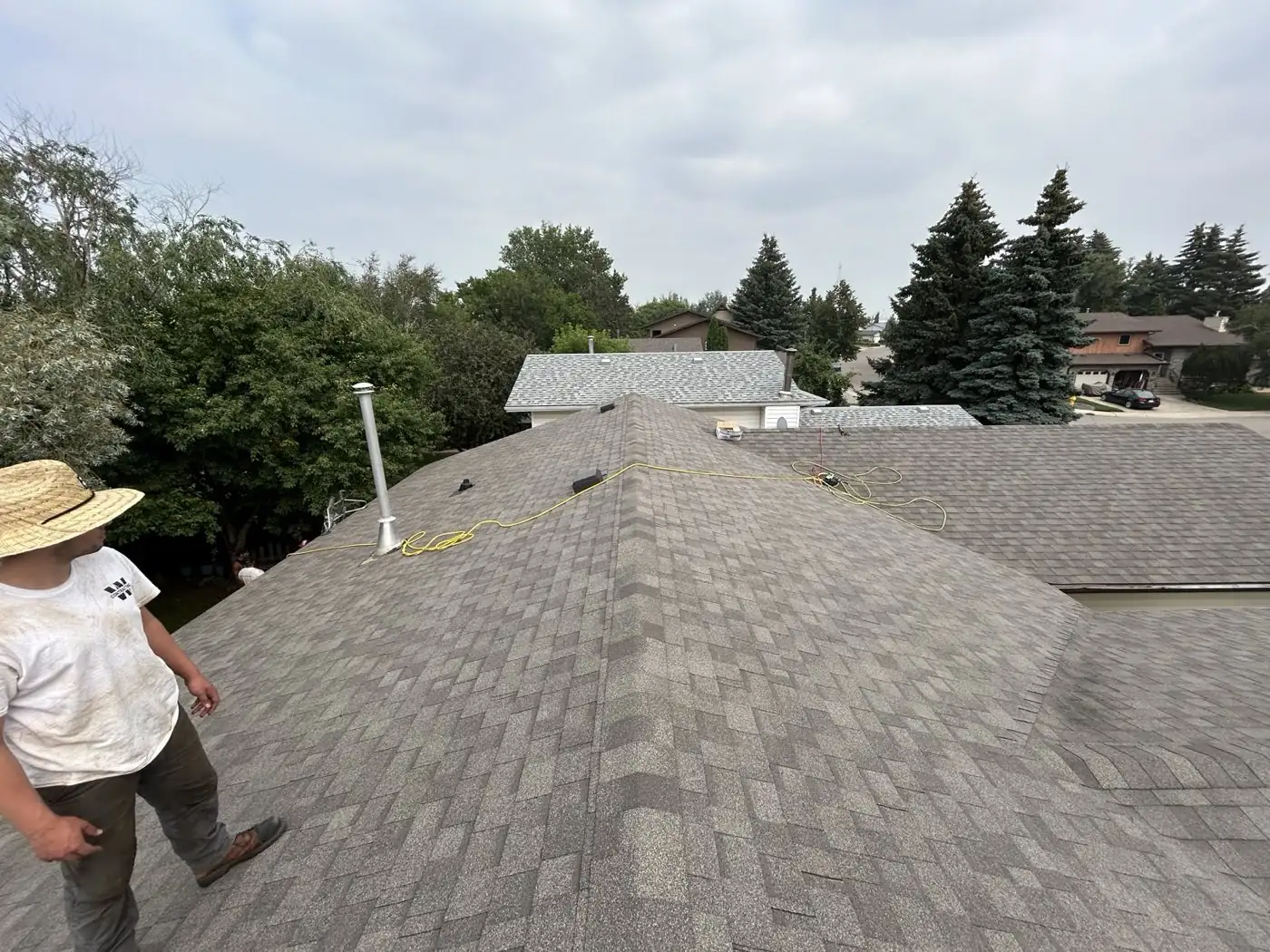 Walking a finished hip roof, vents and pipe flashing already in place, Saskatoon, SK, on the Home page