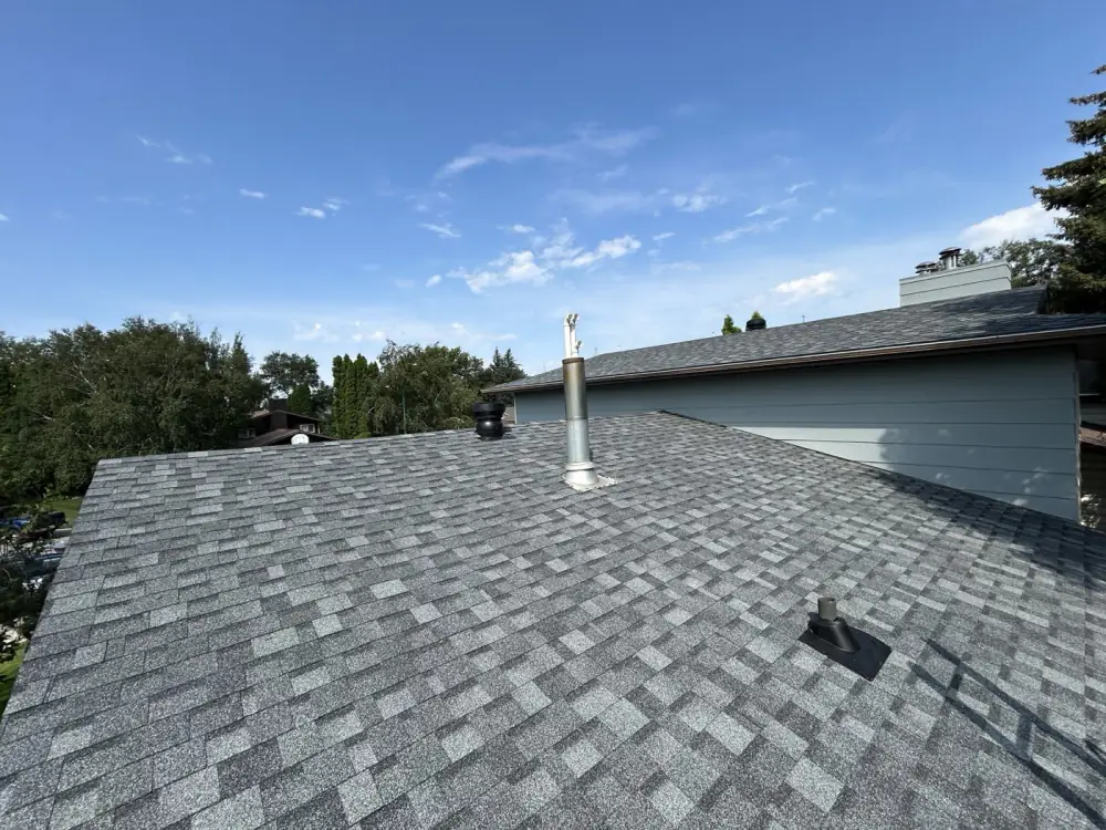 A finished shingle roof with new pipe boots and vent flashing, Saskatoon, SK, on the Home page